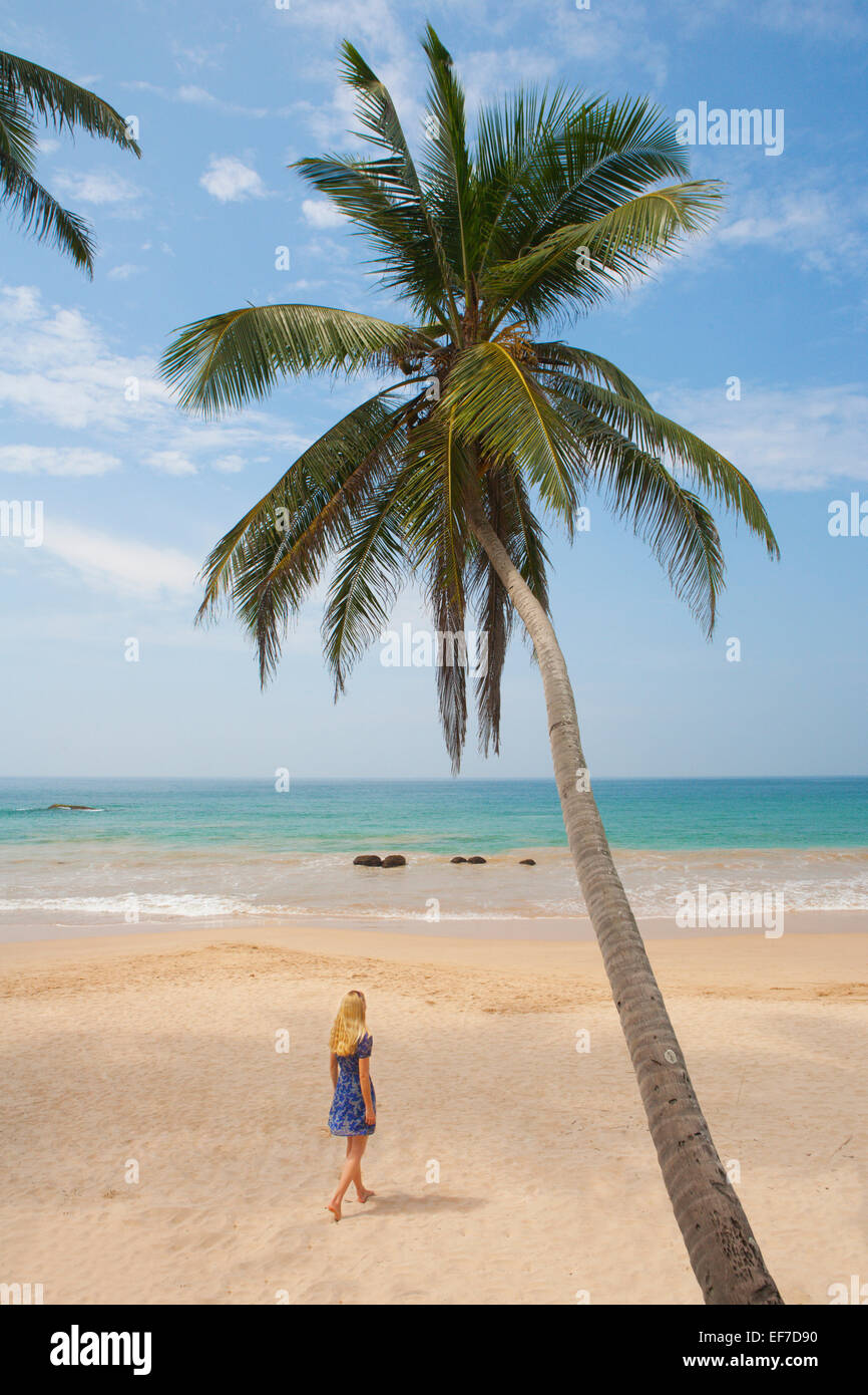 Woman walking beach alone dress hi-res stock photography and images - Alamy
