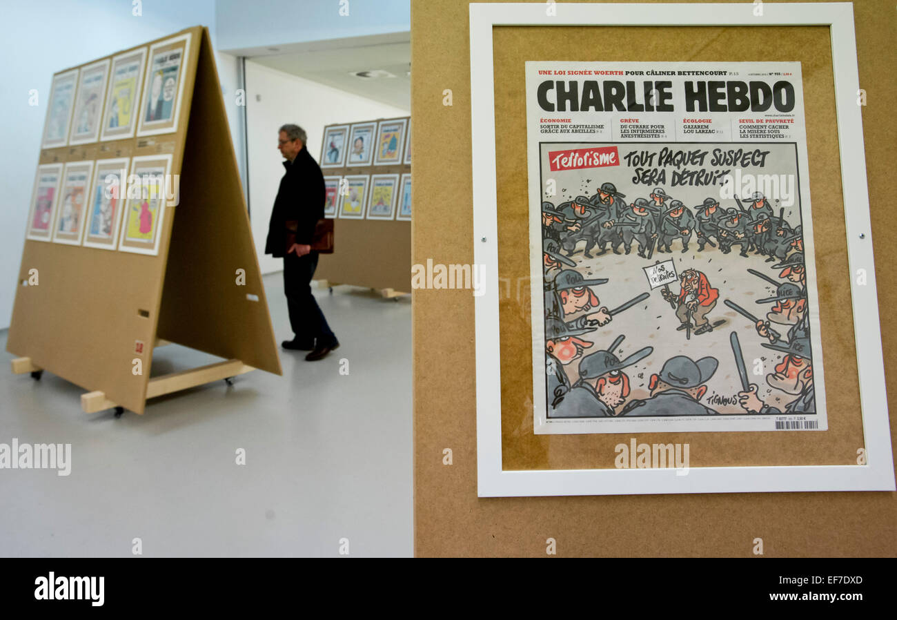 An exhibition presenting nearly 200 front pages of the French satirical magazine Charlie Hebdo, whose Paris editors were recently killed by terrorists, was opened in Prague´s DOX gallery today, on January 28,  2015, amid security measures. On January 7, two armed Islamic radicals stormed the Paris seat of Charlie Hebdo and killed 12 people in its office, including the editor-in-chief and leading cartoonists. The weekly has been publishing caricatures of the Prophet Muhammad as well as mocking other religious and political leaders or the untouchable Tour de France cycling race. People in France Stock Photo