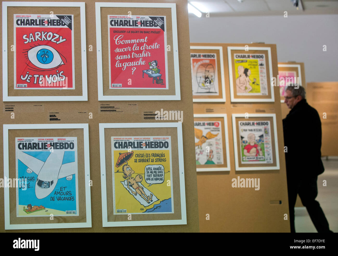 An exhibition presenting nearly 200 front pages of the French satirical magazine Charlie Hebdo, whose Paris editors were recently killed by terrorists, was opened in Prague´s DOX gallery today, on January 28,  2015, amid security measures. On January 7, two armed Islamic radicals stormed the Paris seat of Charlie Hebdo and killed 12 people in its office, including the editor-in-chief and leading cartoonists. The weekly has been publishing caricatures of the Prophet Muhammad as well as mocking other religious and political leaders or the untouchable Tour de France cycling race. People in France Stock Photo