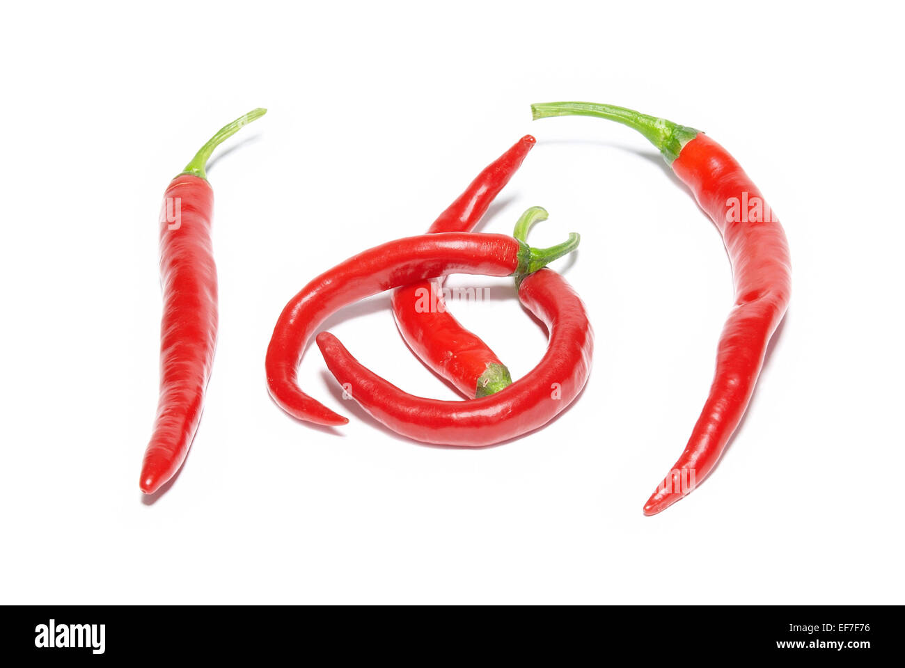 Red hot chili peppers isolated on white Stock Photo - Alamy