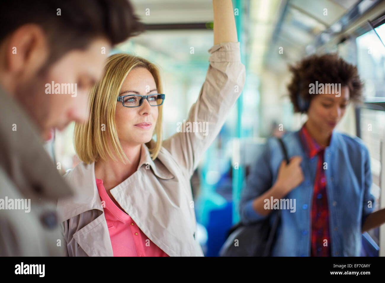 Businesswoman riding train Stock Photo