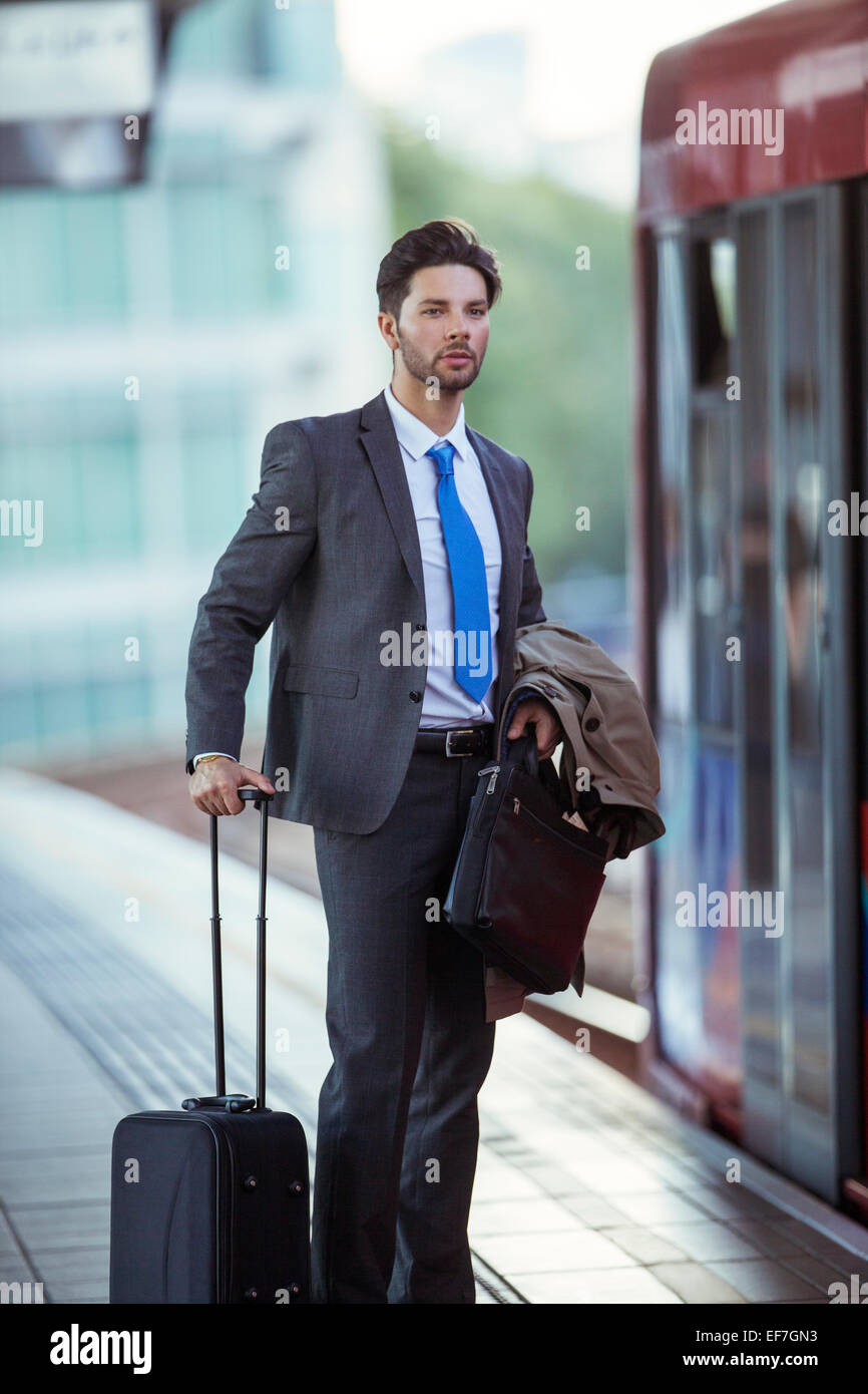 Businessman waiting at train station Stock Photo