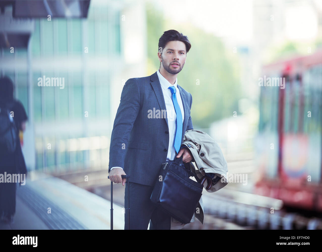 Businessman waiting at train station Stock Photo