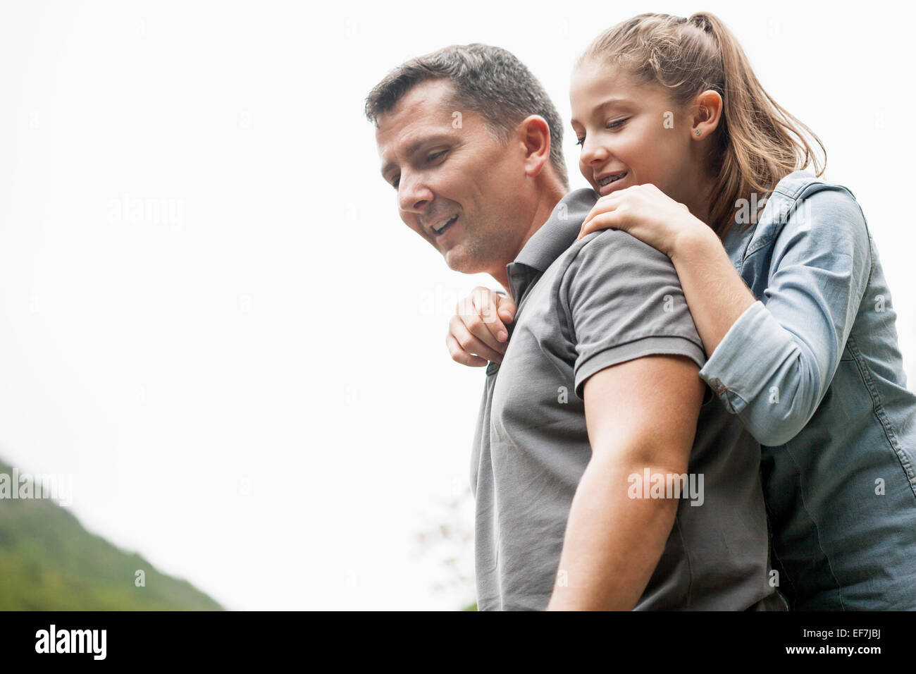 Father and daughter enjoying in a park Stock Photo - Alamy