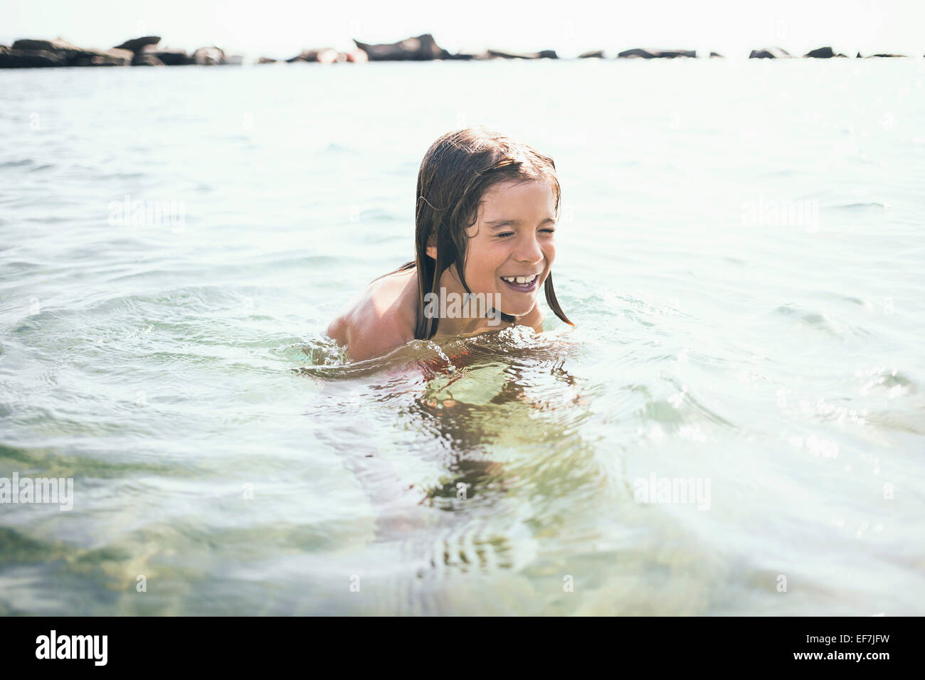 Boy swimming in a lake Stock Photo Alamy