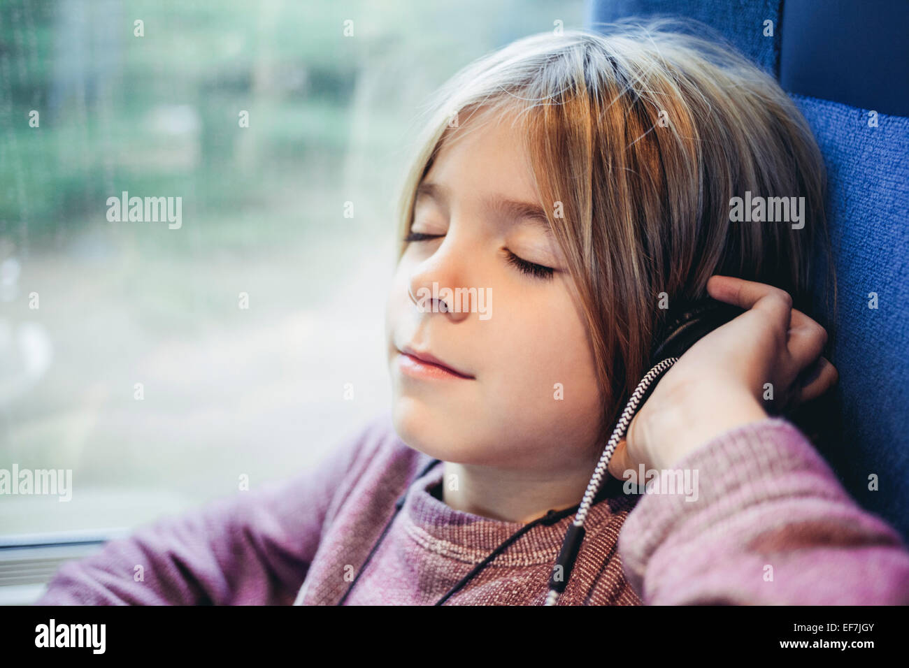 Boy listening to music Stock Photo