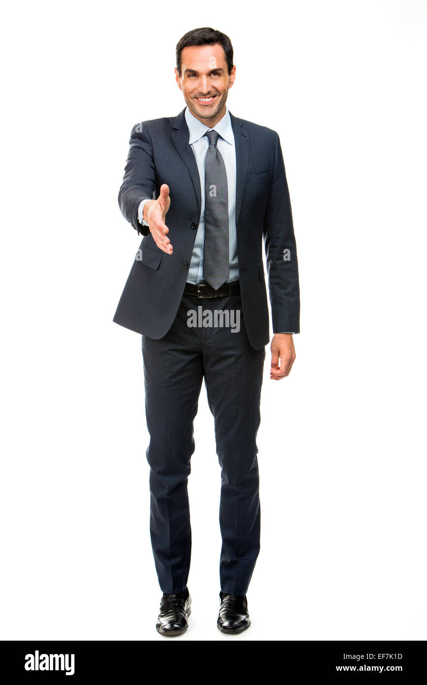Full length portrait of a businessman smiling raising his arm for shaking hands Stock Photo