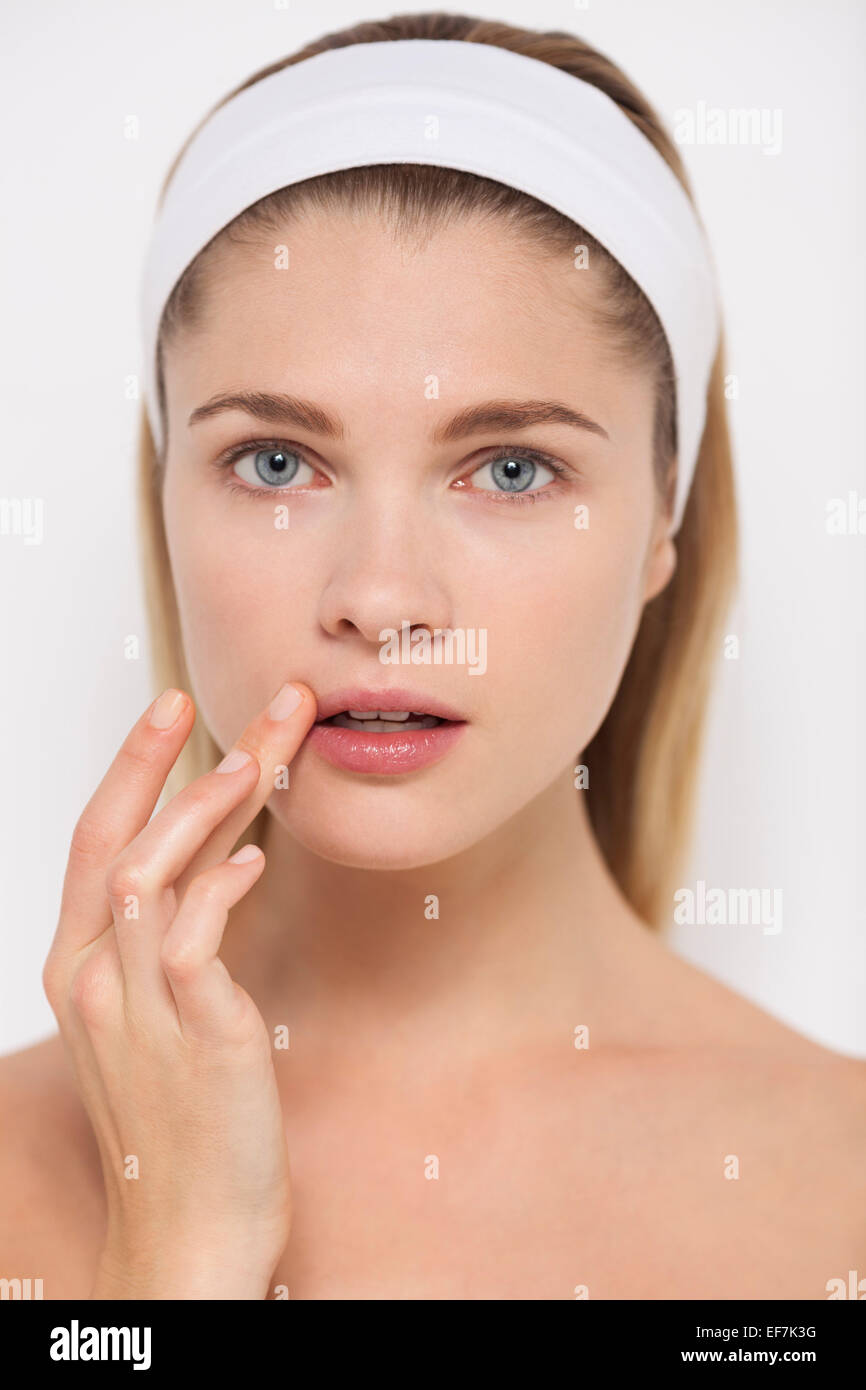 Beautiful woman touching her lips Stock Photo Alamy