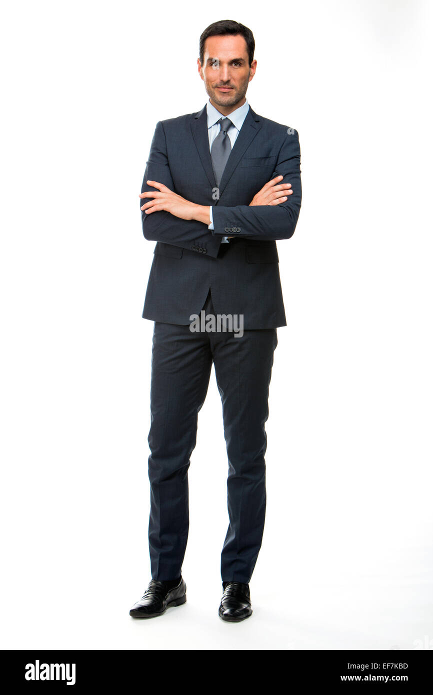 Full length portrait of a businessman looking at camera with crossed ...
