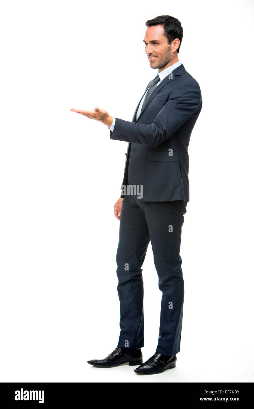 Full length  portrait of a smiling businessman in suit with lifted arm Stock Photo
