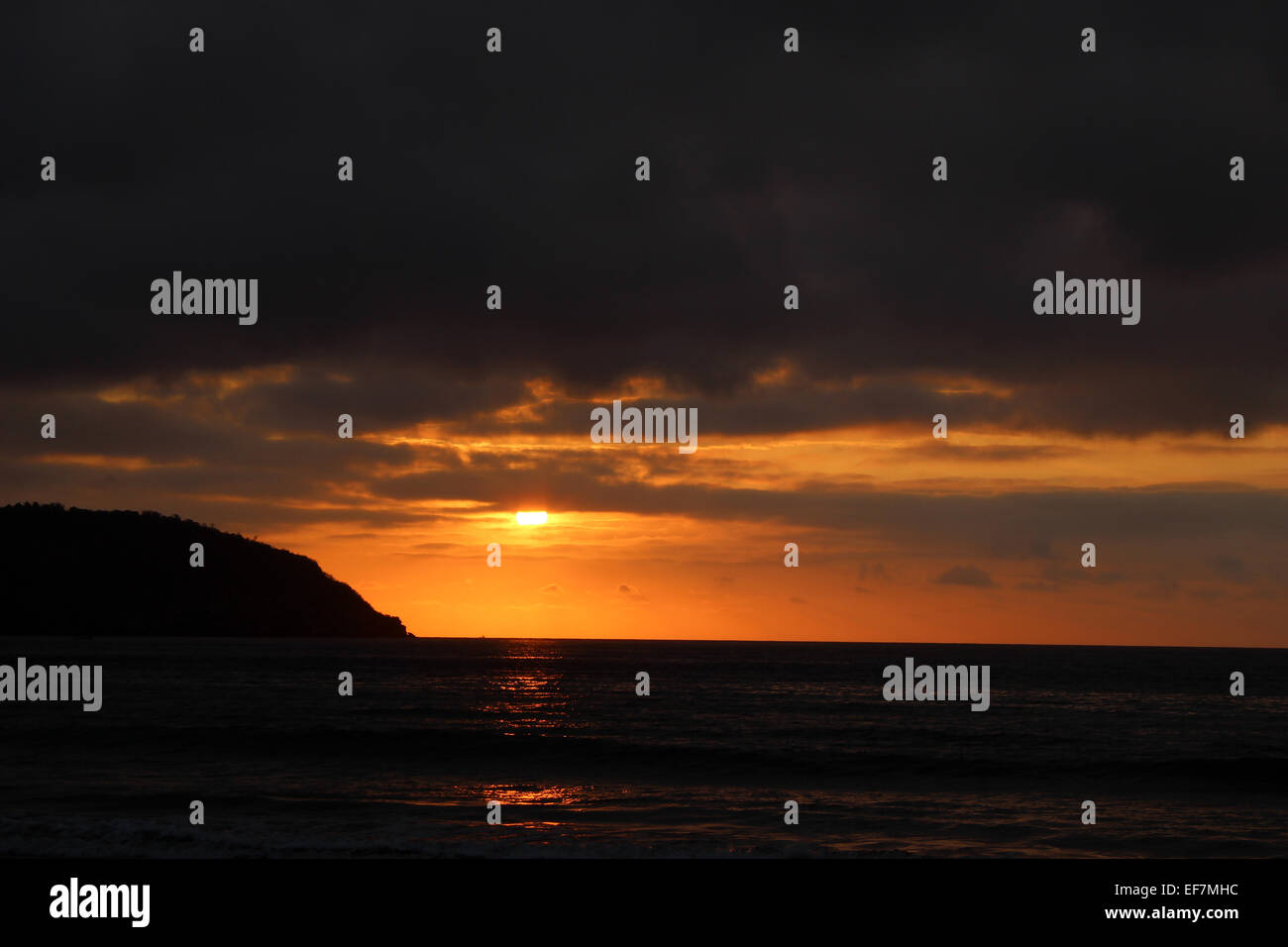 A sunset over the Pacific Ocean in Puerto Lopez, Ecuador Stock Photo