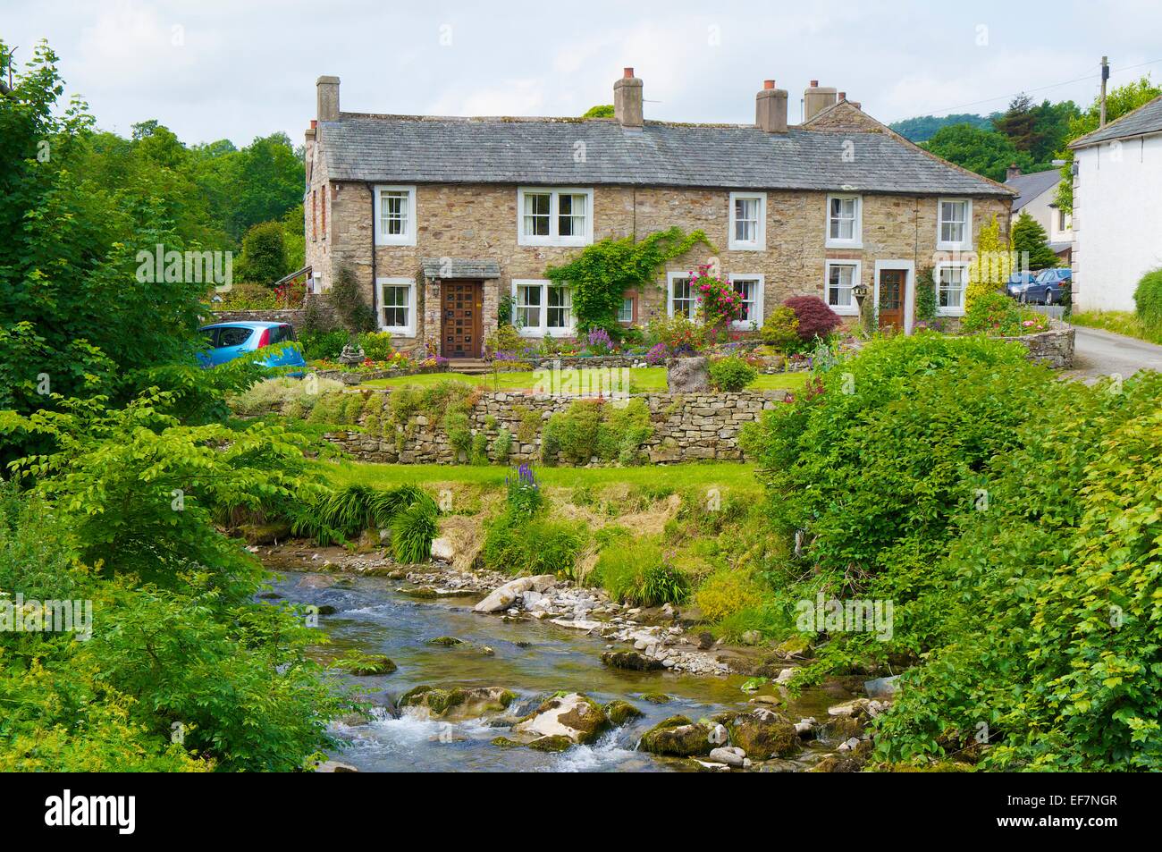 Cottages above the river Cald Beck, Calbeck Cumbria England UK. Stock Photo