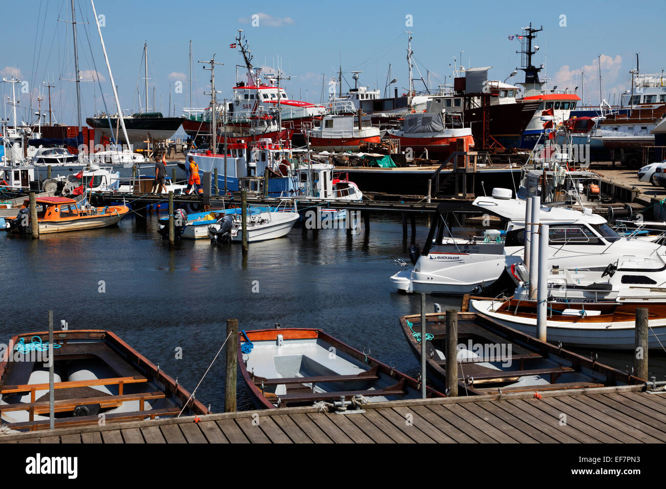 Gilleleje Harbour, North Sealand, Denmark, on a warm and sunny summer's day. Shipyard and slipway in the background. Stock Photo