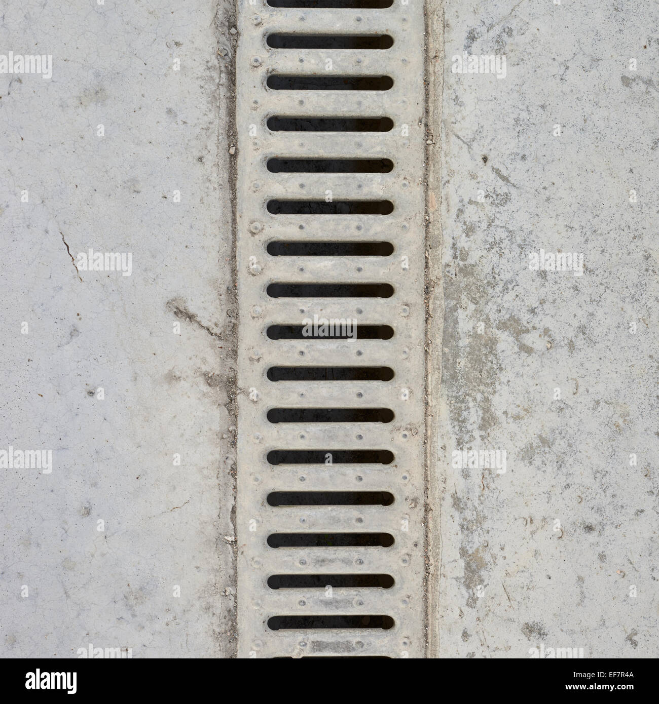 Drain grate in concrete floor Stock Photo Alamy