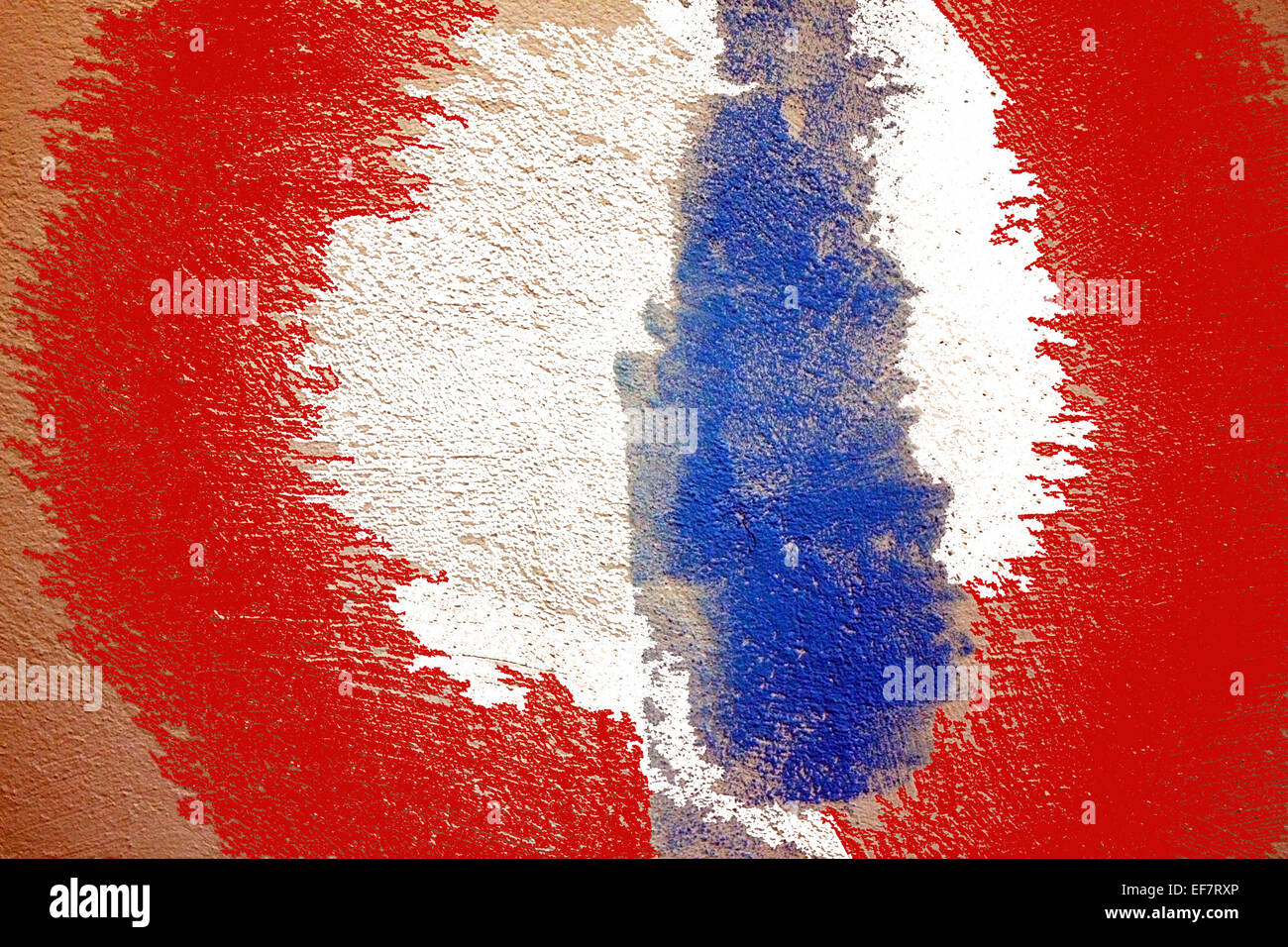 Tricolor. Red, blue and white spots of paint on a plastered wall Stock Photo
