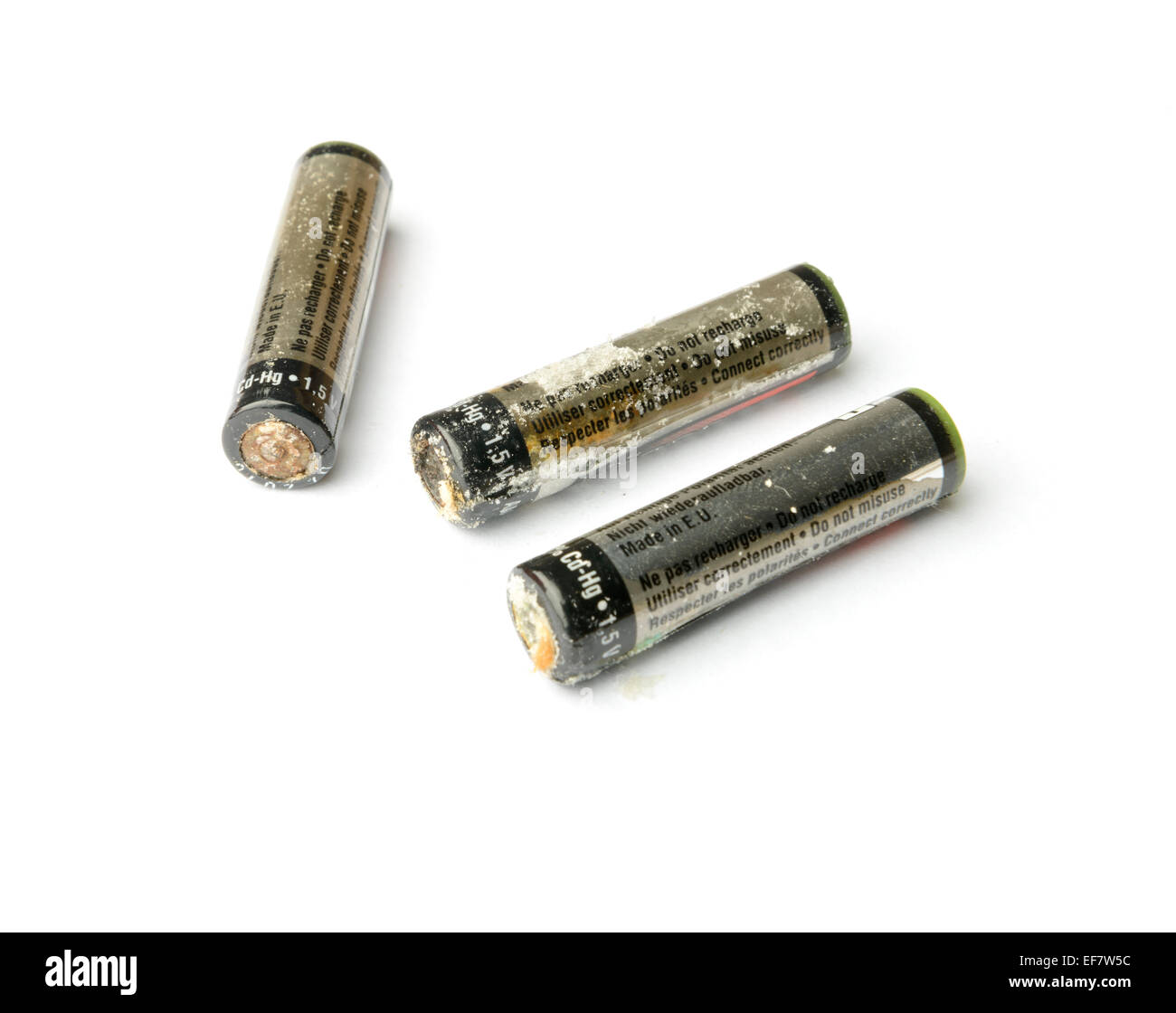 Damaged leaking AA batteries cut out isolated on white background Stock Photo