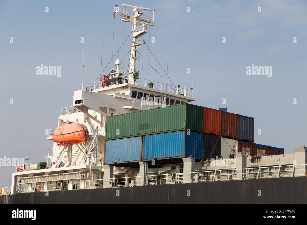 Cargo ship loading trading port Stock Photo - Alamy