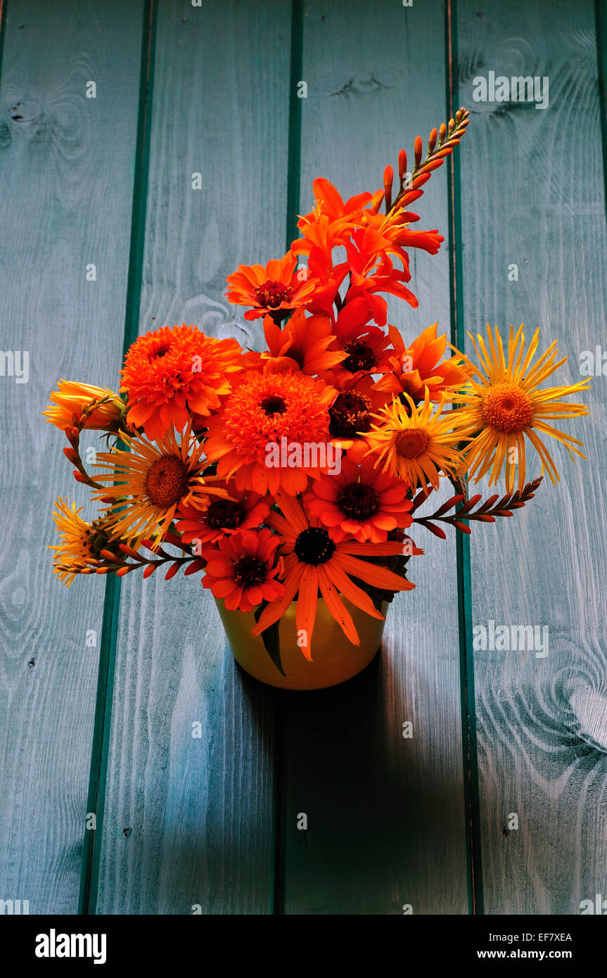 An orange and yellow themed cut flower arrangement UK Stock Photo