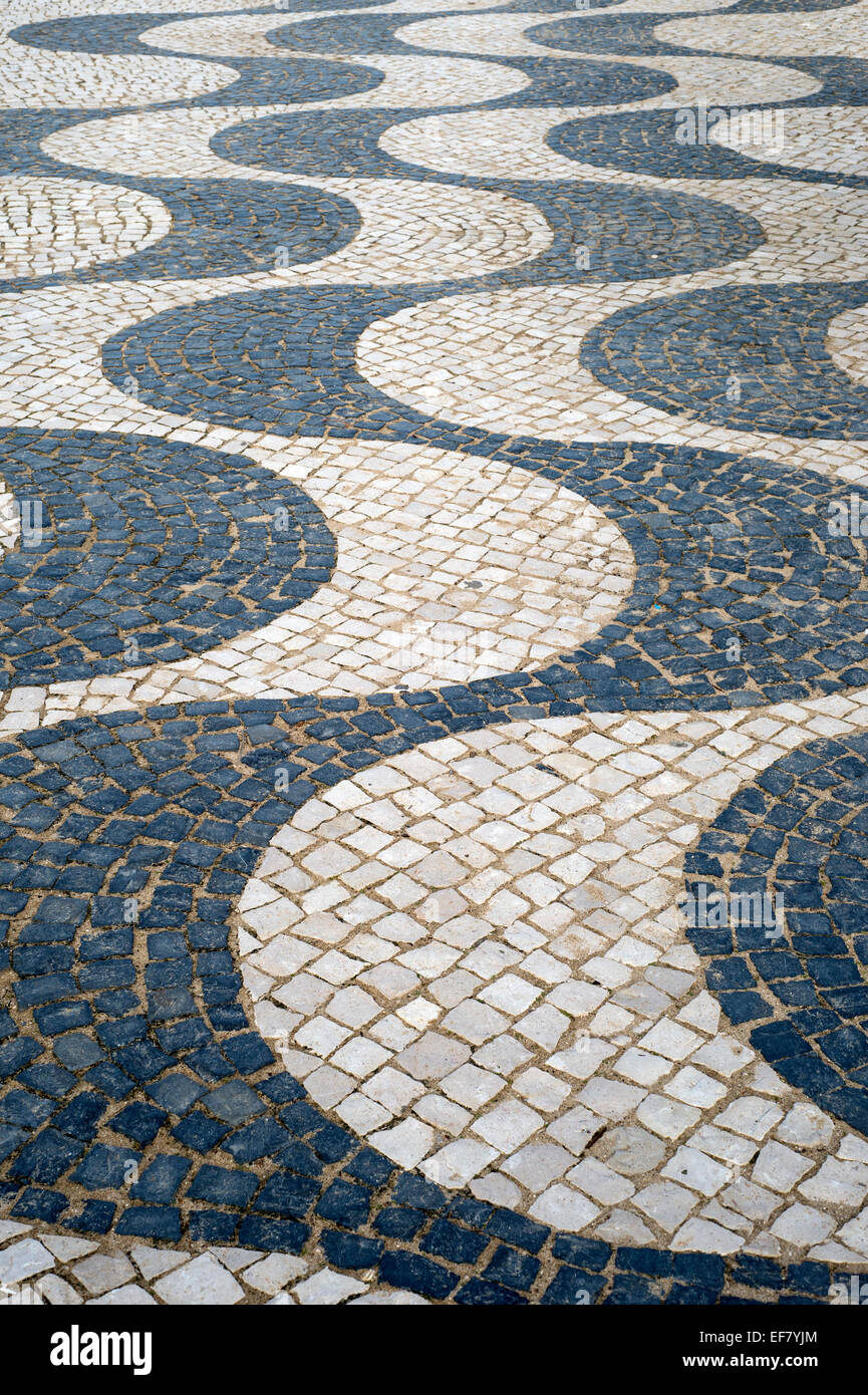 traditional Portuguese cobbled pavements with wavy lines in the coastal town of Praia da Luz Stock Photo