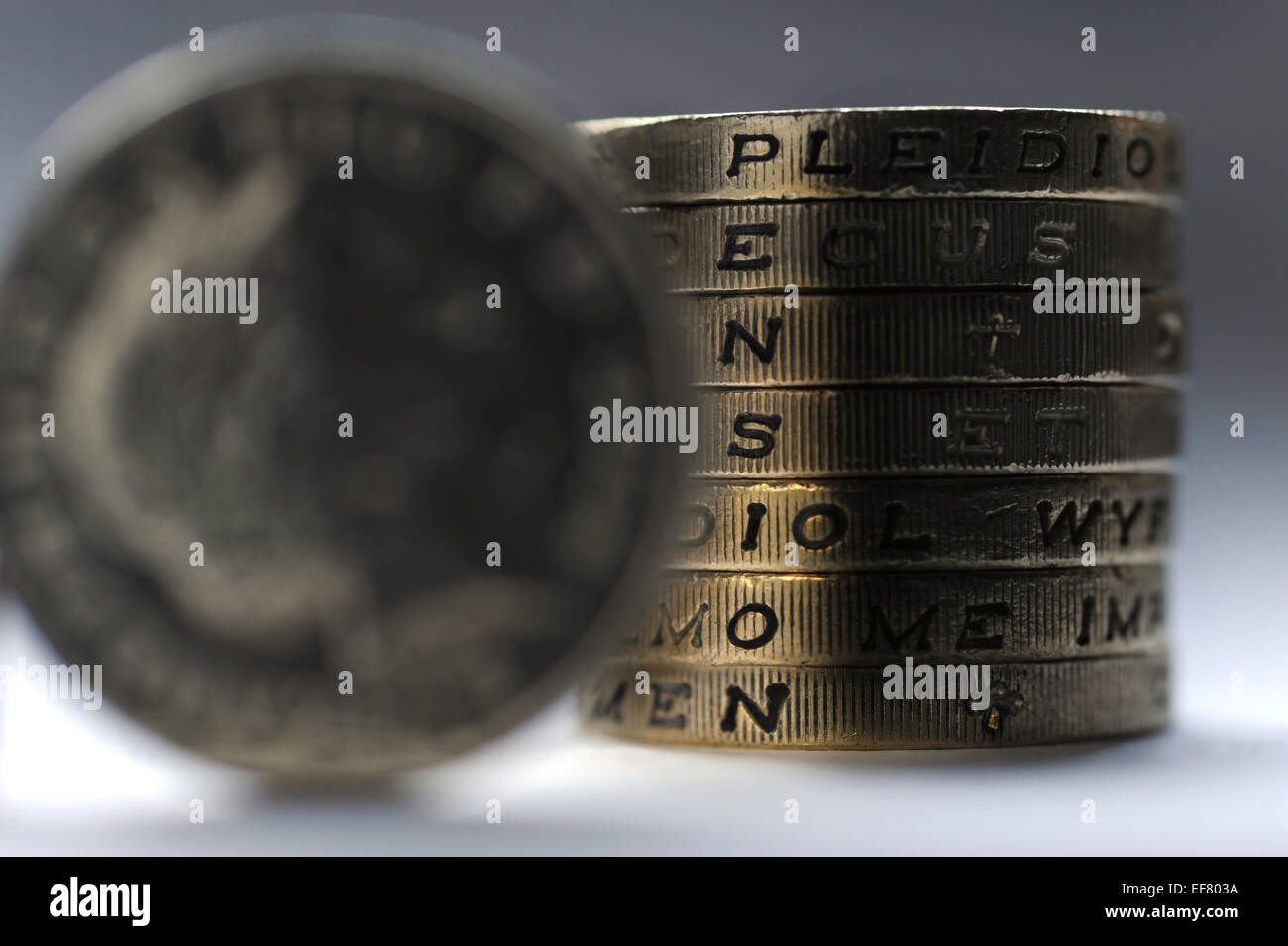 ONE POUND COIN STACK SPELLING WORD PENSION RE PENSIONS PRIVATE COMPANY SCHEME POT PERSONAL SAVINGS RETIREMENT PENSIONERS UK Stock Photo