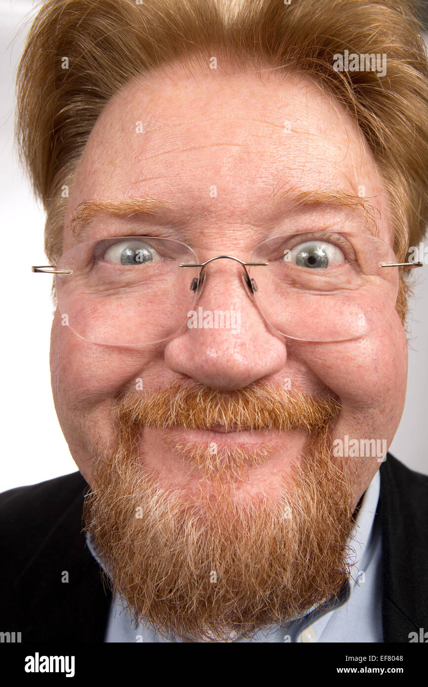 Comical bearded man make a wild and funny expression on his face. Stock Photo