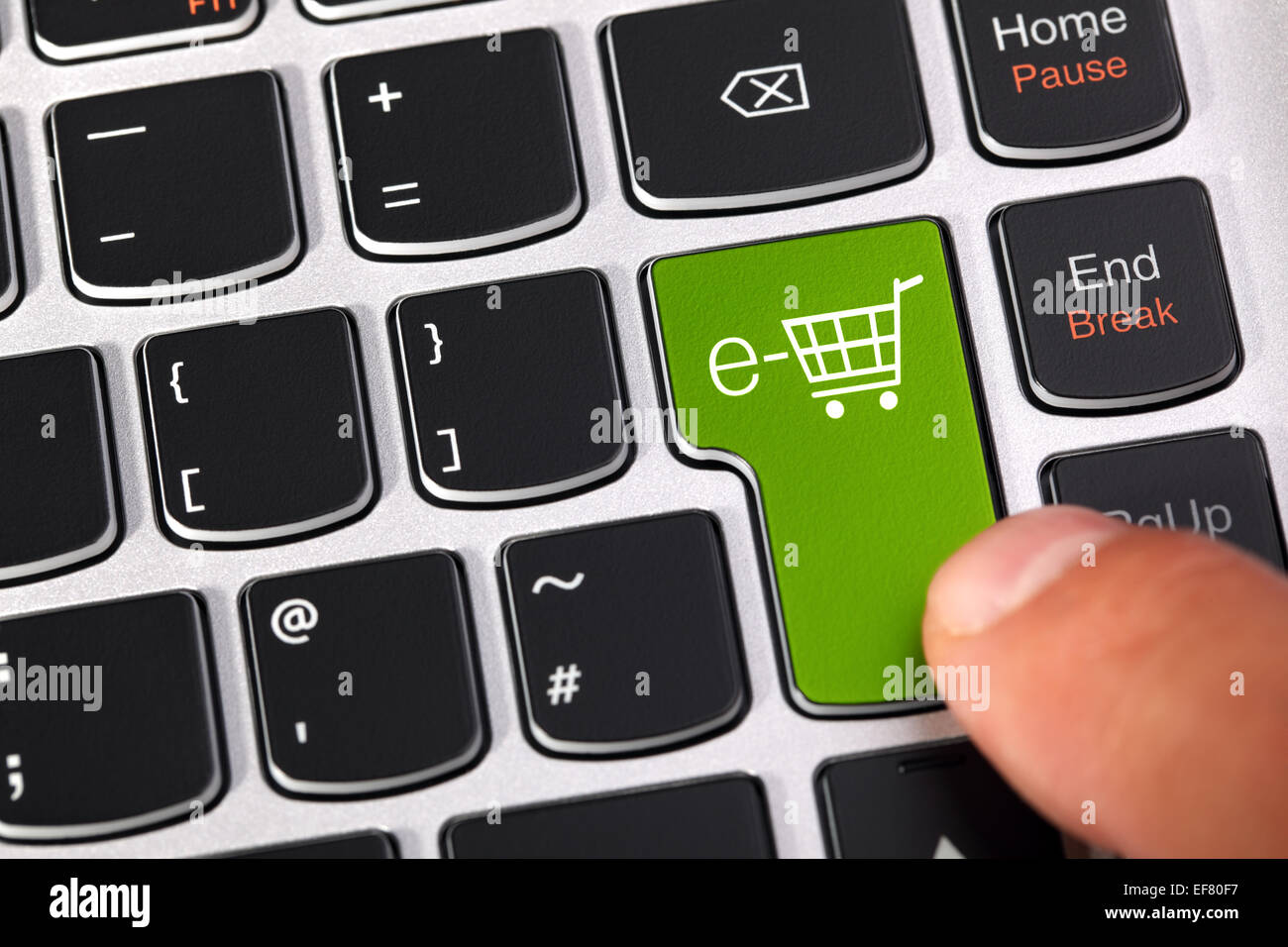 Computer keyboard key with shopping cart icon concept for e-commerce, consumerism and internet store checkout Stock Photo