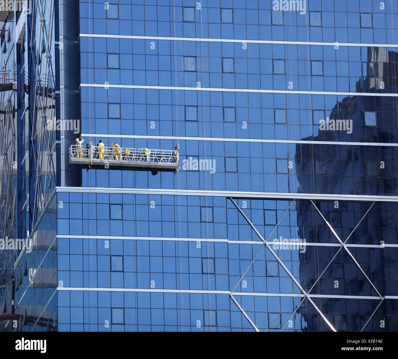 Window cleaner and maintenance on the outside of a skyscraper Stock Photo