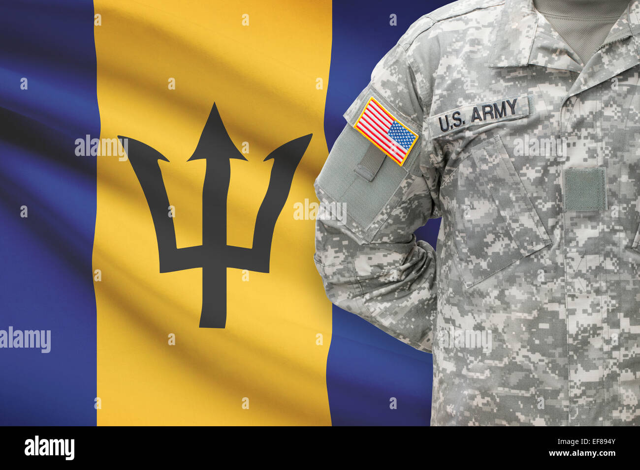 American soldier with flag on background - Barbados Stock Photo