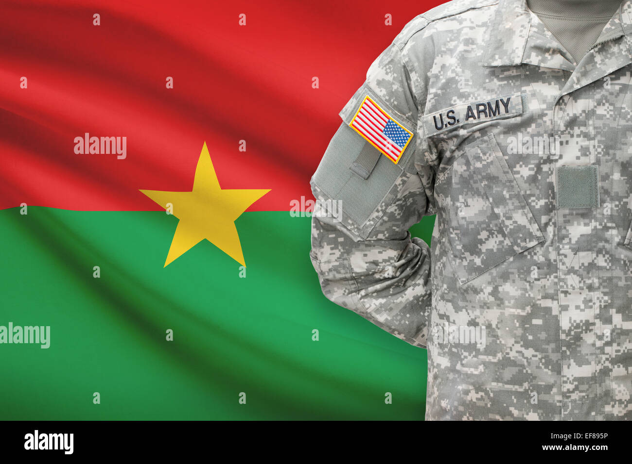 American soldier with flag on background - Burkina Faso Stock Photo