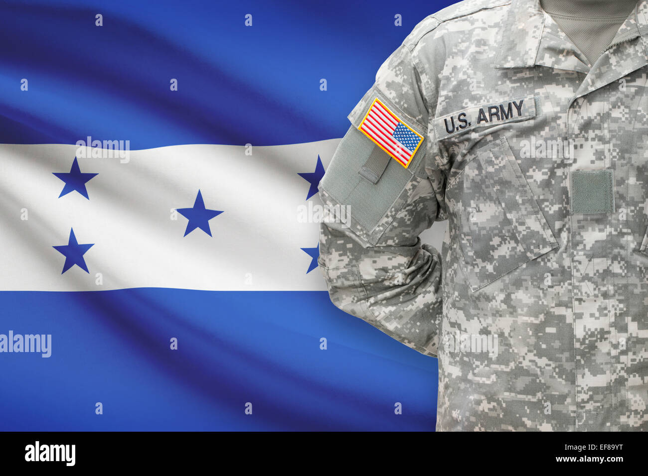 American soldier with flag on background - Honduras Stock Photo
