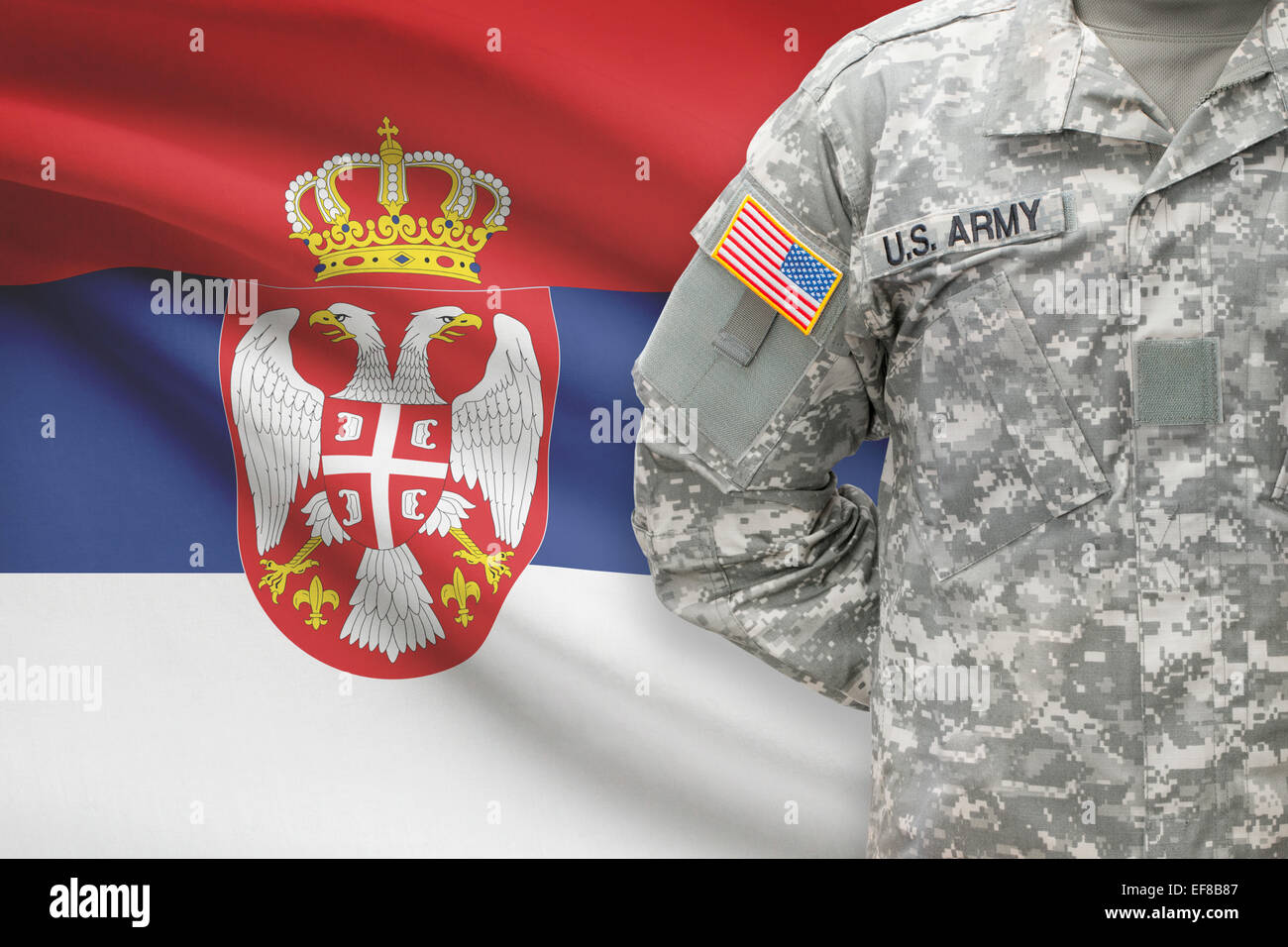 American soldier with flag on background - Serbia Stock Photo