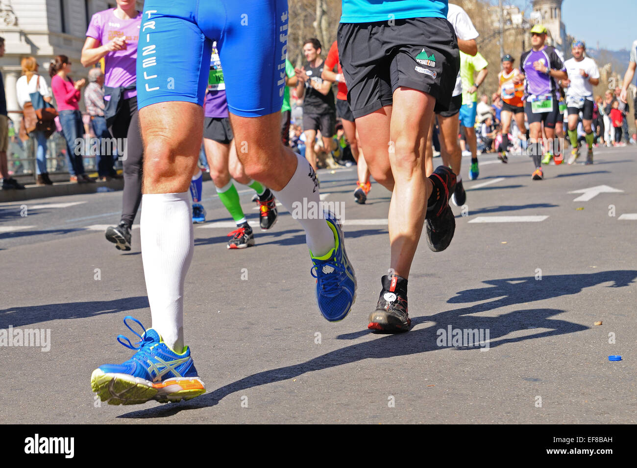 BARCELONA - MAR 16: People run in the Zurich Barcelona Marathon through the streets of the city. Stock Photo