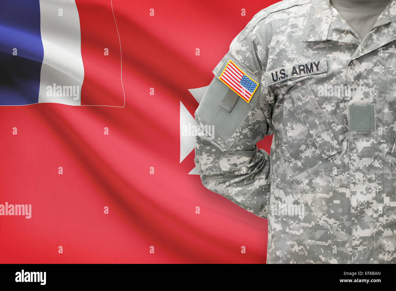 American soldier with flag on background - Wallis and Futuna Stock Photo