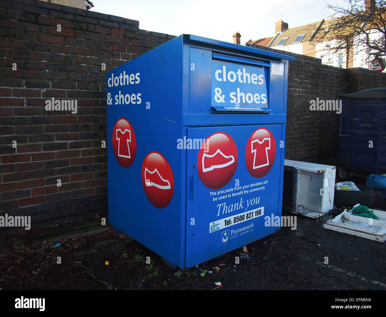 A charity clothes and shoes recycling collection point Stock Photo