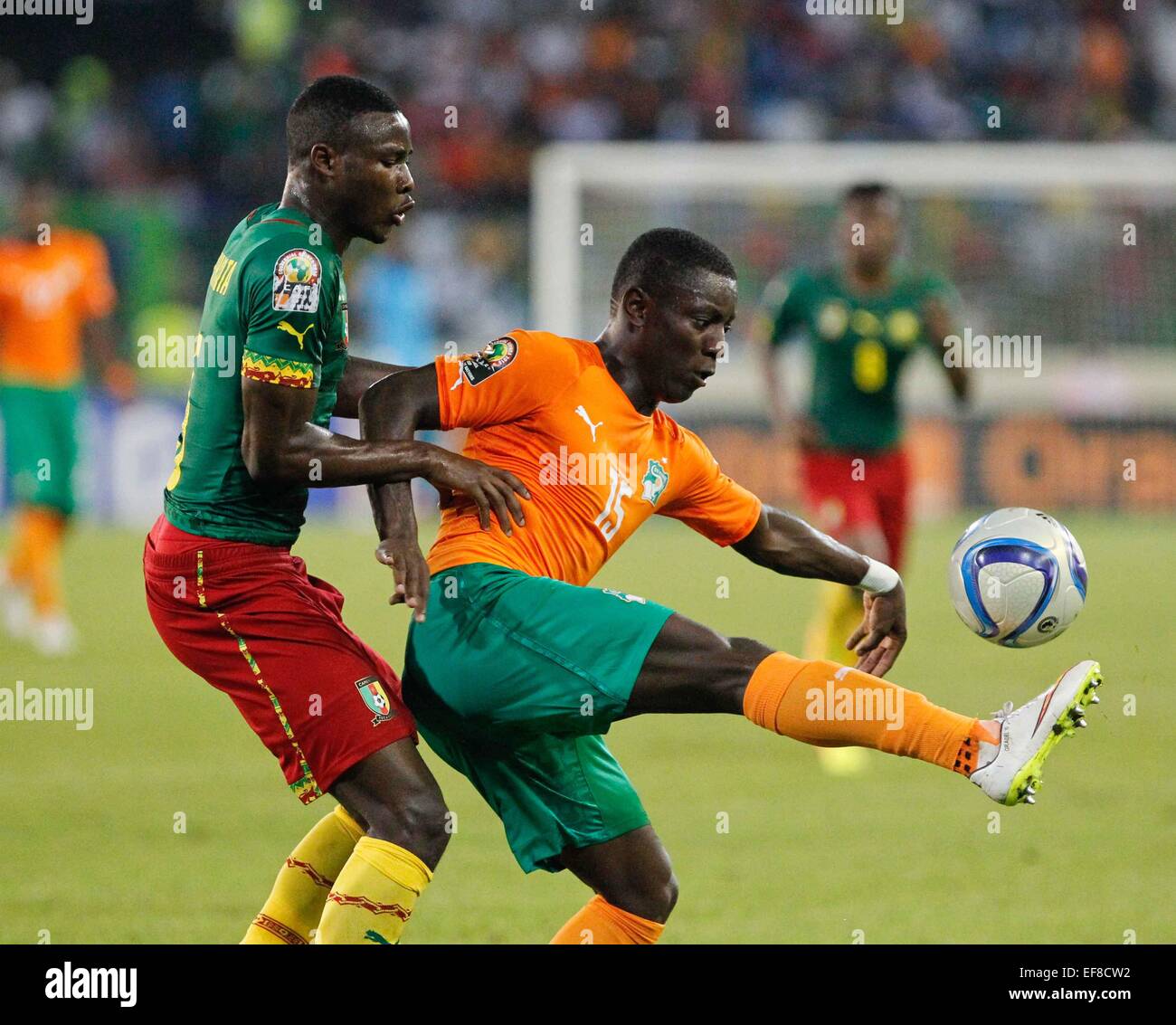 Malabo, Equatorial Guinea. 28th Jan, 2015. Max Alain Gradel (R) of Cote d'Ivoire competes during the group match of Africa Cup of Nations against Cameroon at the Stadium of Malabo, Equatorial Guinea, Jan. 28, 2015. Cote d'Ivoire won 1-0. Credit:  Li Jing/Xinhua/Alamy Live News Stock Photo