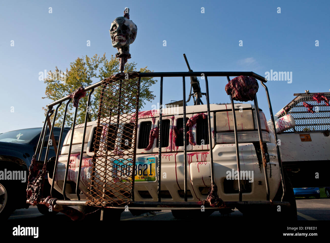 Front of a zombie hunting car, with grate and heads on the front. Stock Photo