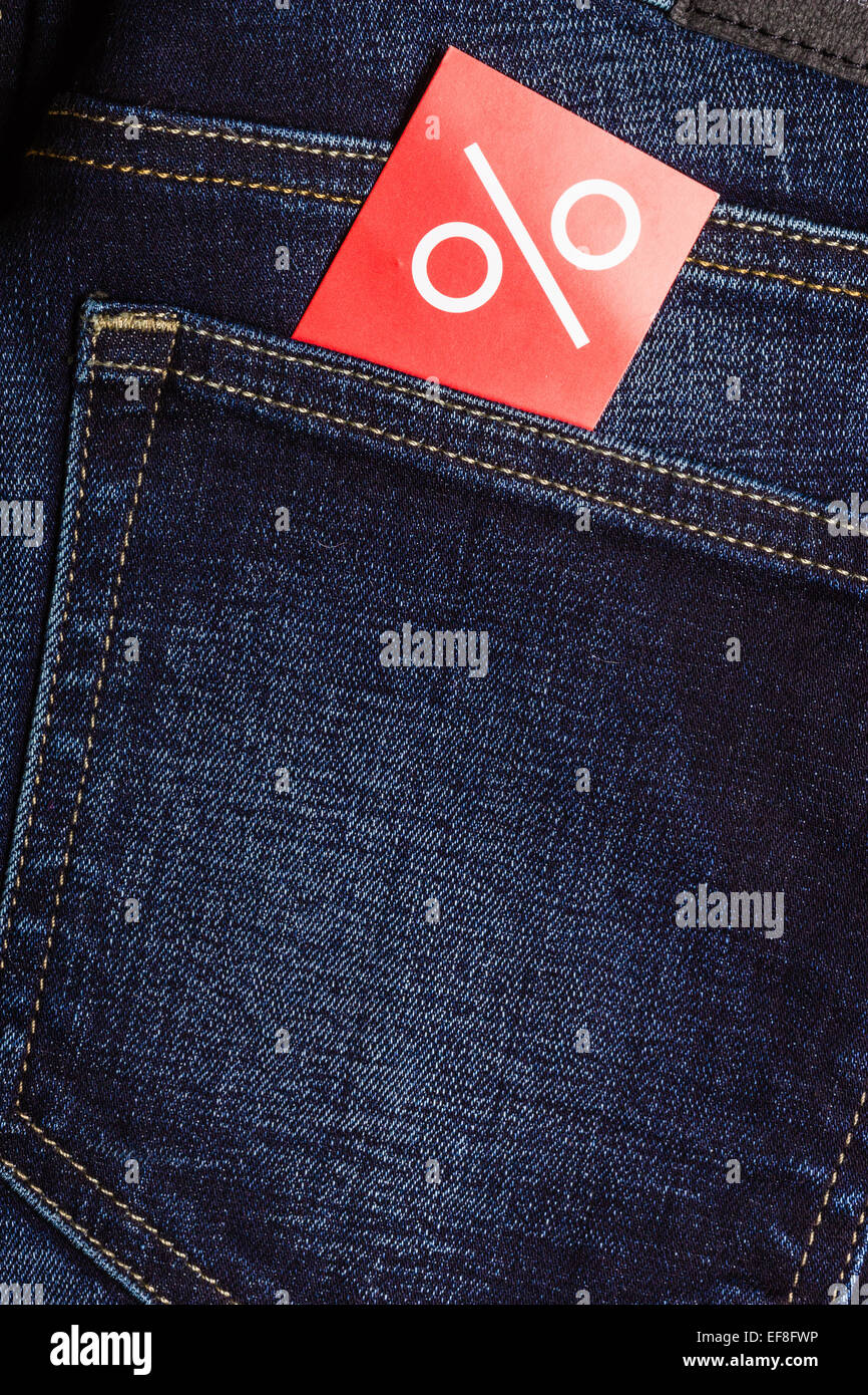 Shopping and sale concept. Closeup red label with percent sign on navy