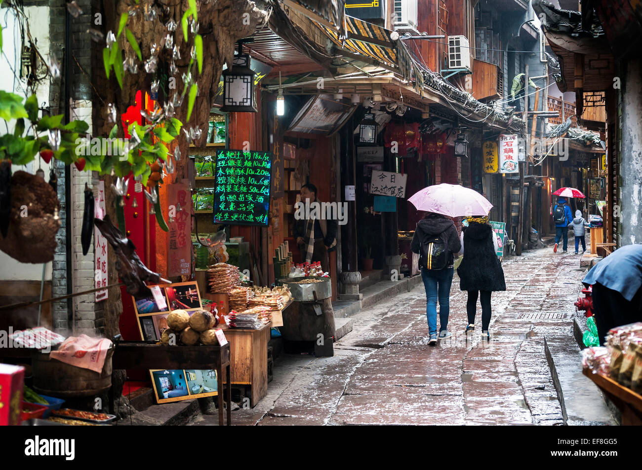 Tourists browse Fenghuang's local shops, Hunan Province, China Stock Photo