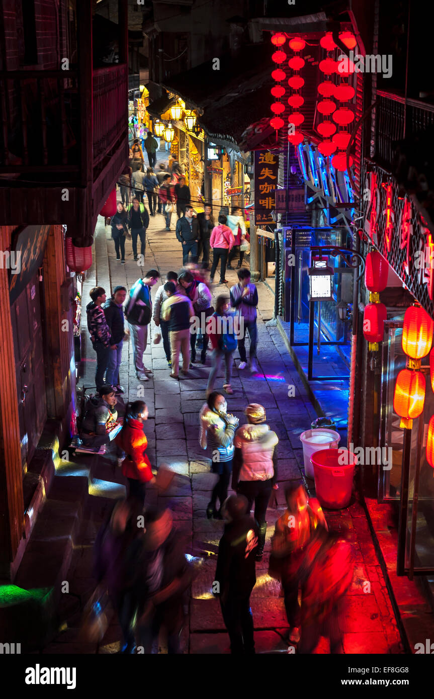 Street of neon-lit bars in Fenghuang old-town, China Stock Photo