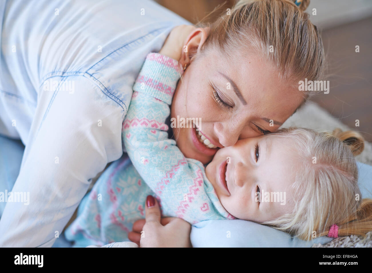 Affectionate female and her daughter in embrace Stock Photo