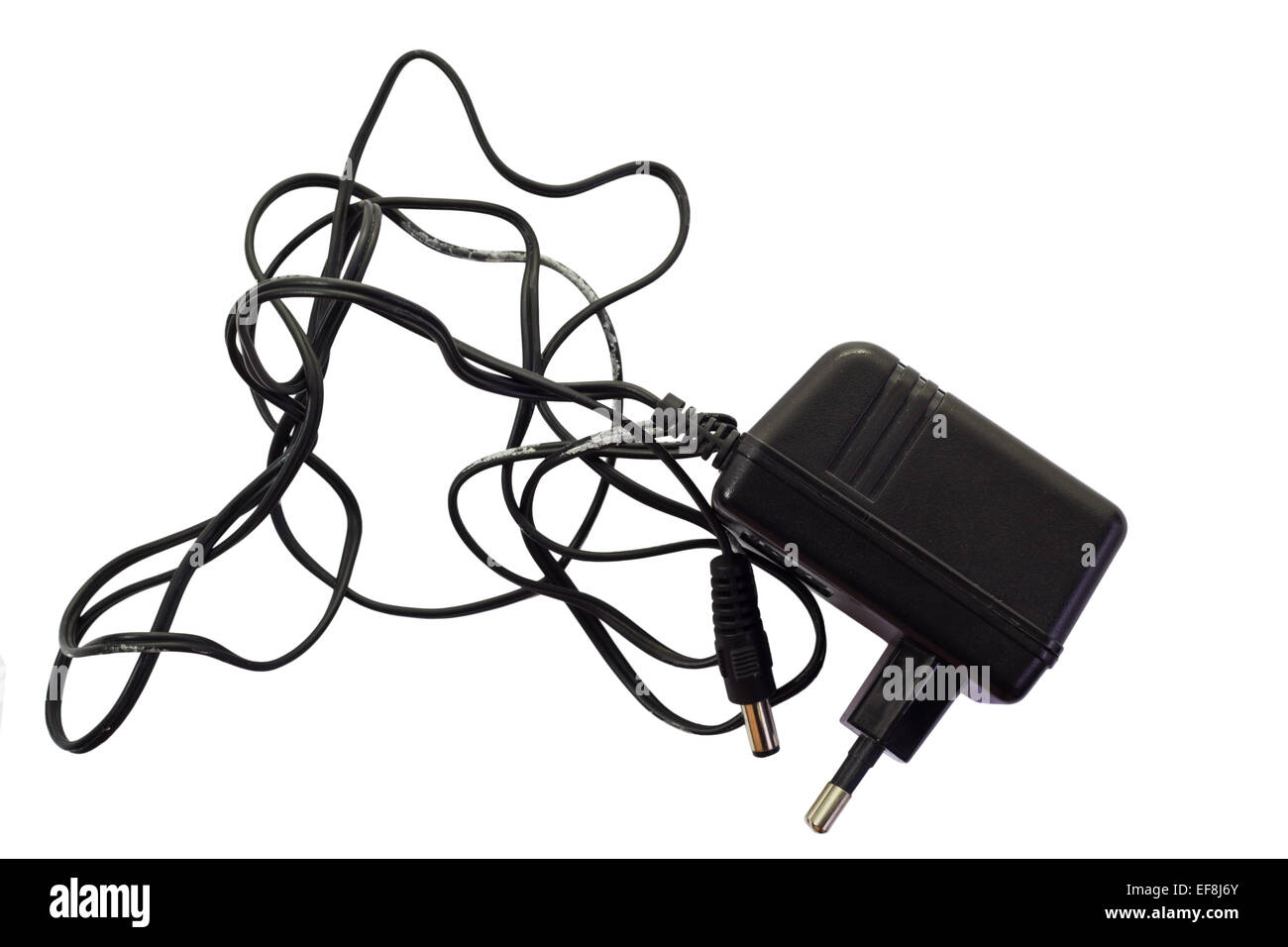 Stained black electric adapter isolated  on white background  and clipping path Stock Photo