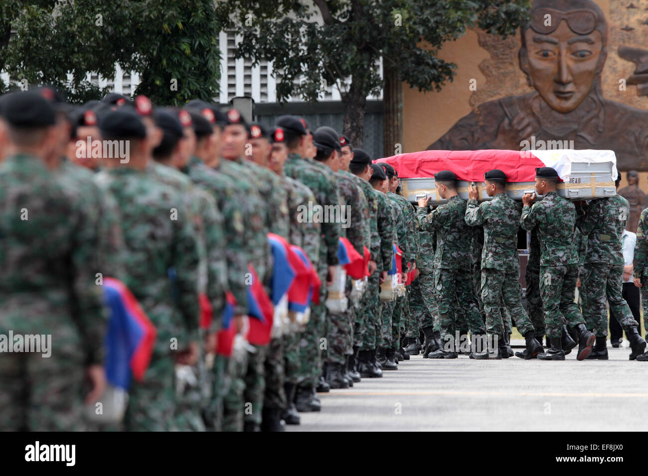 Pasay City, Philippines. 29th Jan, 2015. Members of the Philippine National Police Special Action Force (PNP-SAF) carry the caskets of their fallen comrades at the Villamor Air Base in Pasay City, the Philippines, Jan. 29, 2015. Forty-four members of the PNP-SAF were killed allegedly by Moro Islamic Liberation Front and Bangsamoro Islamic Freedom Fighters members on Jan. 25 in Mamasapano, Maguindanao. Credit:  Rouelle Umali/Xinhua/Alamy Live News Stock Photo
