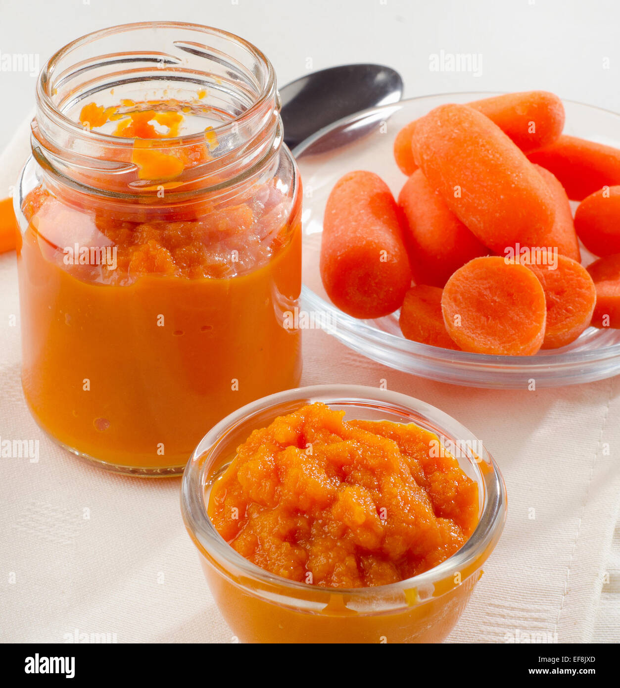 Baby healthy  food -  pureed carrot and juice. Selective focus Stock Photo