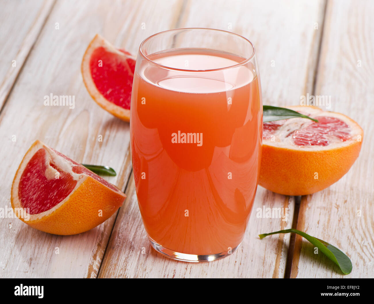 Fresh grapefruit juice  on a wooden table. Selective focus Stock Photo