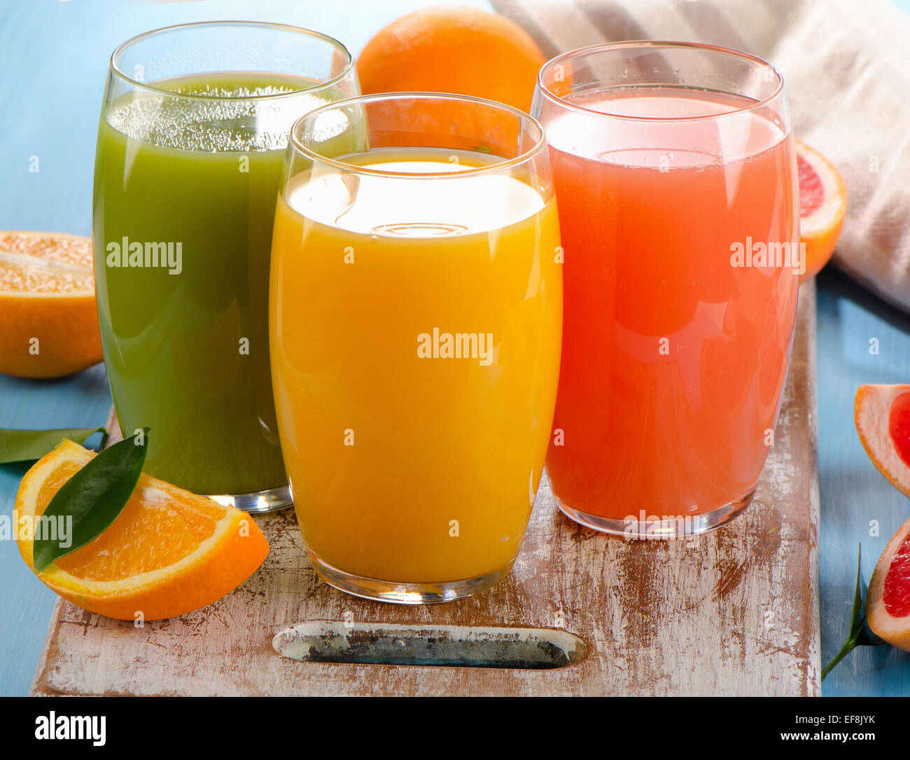 Fresh citrus juices in glasses. Selective focus Stock Photo