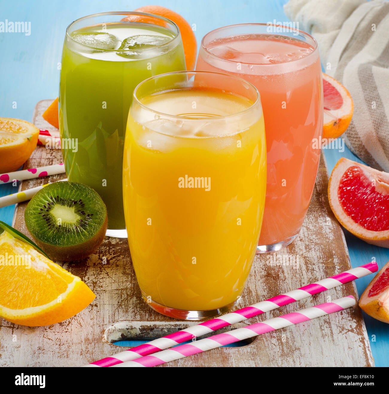 Fresh citrus juices in glasses. Selective focus Stock Photo
