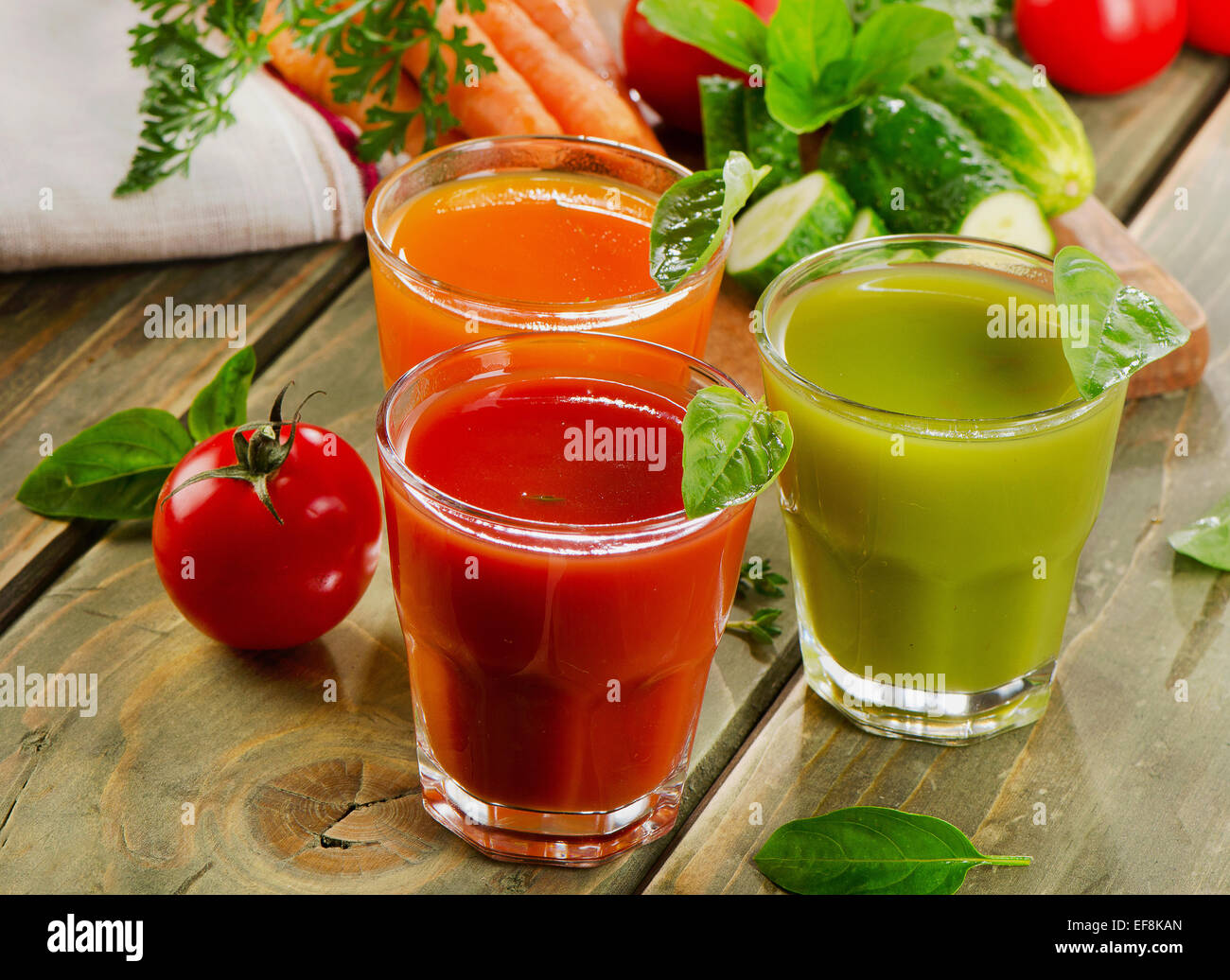 Fresh healthy vegetable  juices on a wooden table. Selective focus Stock Photo