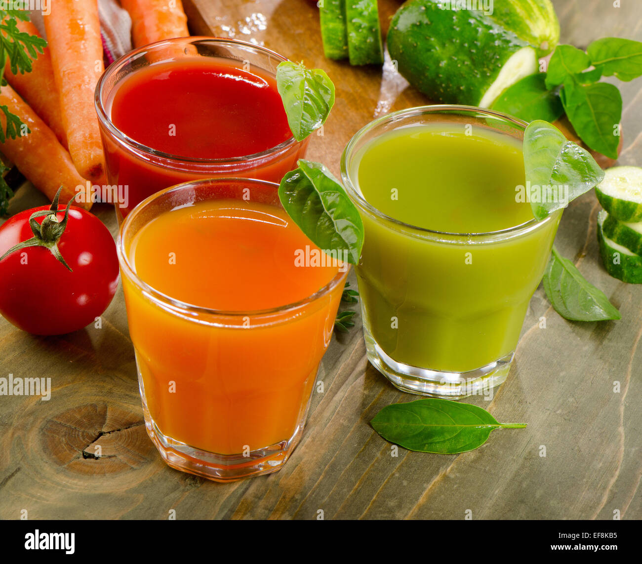 Healthy vegetable  juices on a wooden table. Selective focus Stock Photo