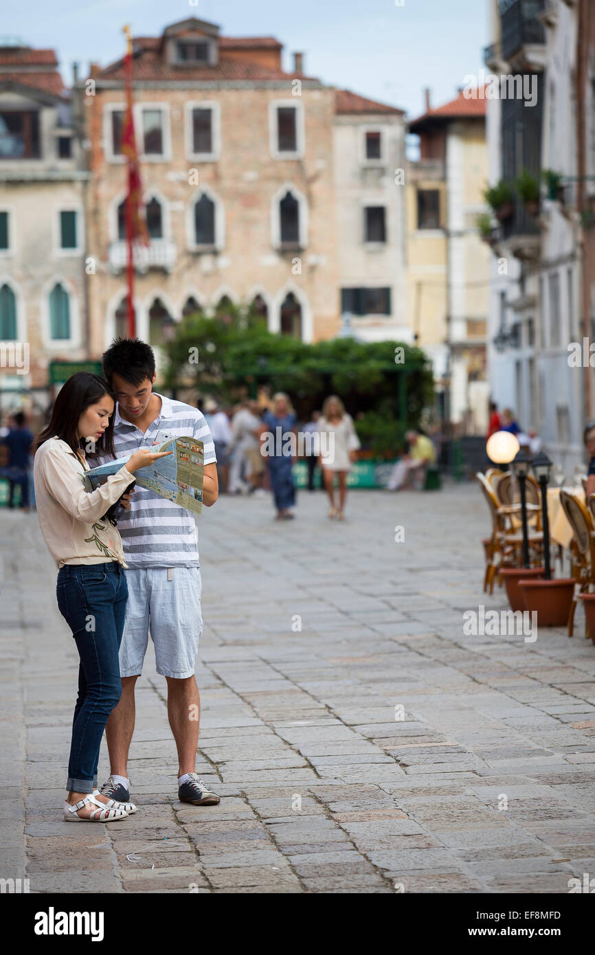 Tourists in Venice reading a map Stock Photo