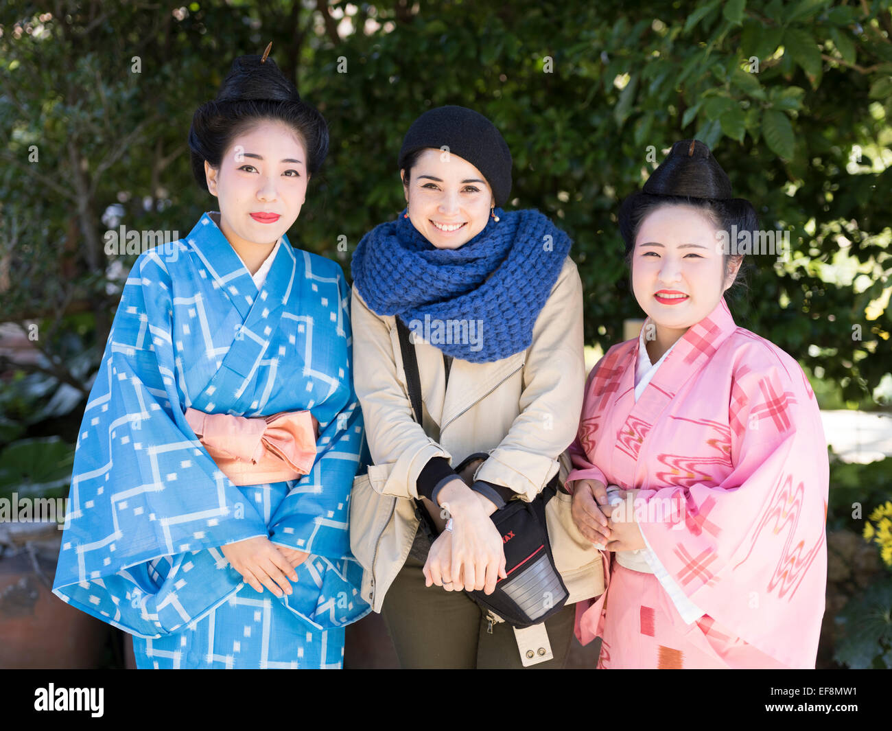 Staff and visitor at Ryukyu Mura, Yomitan Village, Okinawa, Japan Stock Photo